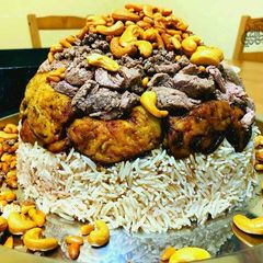 A picture of Eggplant_and_meat_maqlouba/ upside down beef-eggplant and rice:.