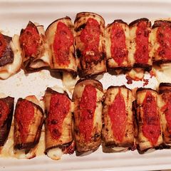 A picture of Eggplant rolls filled with ham & cheese.