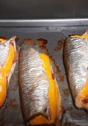 Una foto de Truchas al horno con jamón serrano y queso