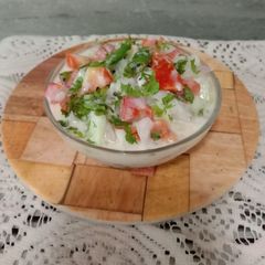 Kakdi, tomato onion raita A picture of Kakdi, tomato onion raita.
