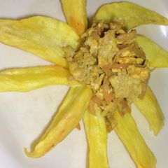 A picture of Sweet potatoes with Onion and egg sauce.