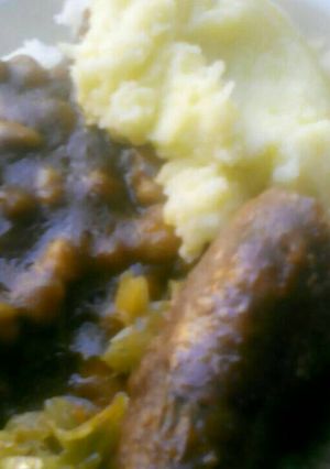 A picture of Sausages, Mashed potatoes with gravy.