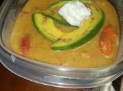 A picture of pumpkin and green onion soup