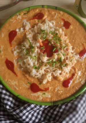 A picture of Maggi in a cheesy tomato sausage.
