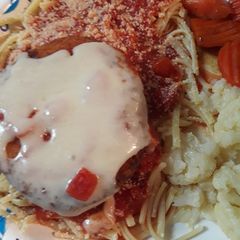 A picture of Swiss on Chicken atop Linguine.