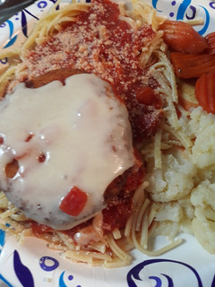 A picture of Swiss on Chicken atop Linguine.