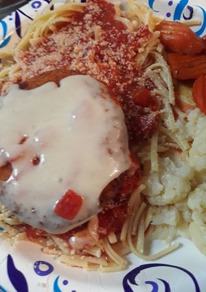 A picture of Swiss on Chicken atop Linguine.