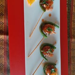A picture of Orange glazed prawn stick.