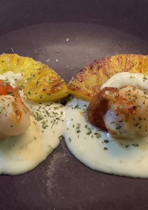 A picture of Scallops with Coconut Lime Cream on Roasted Pineapple.