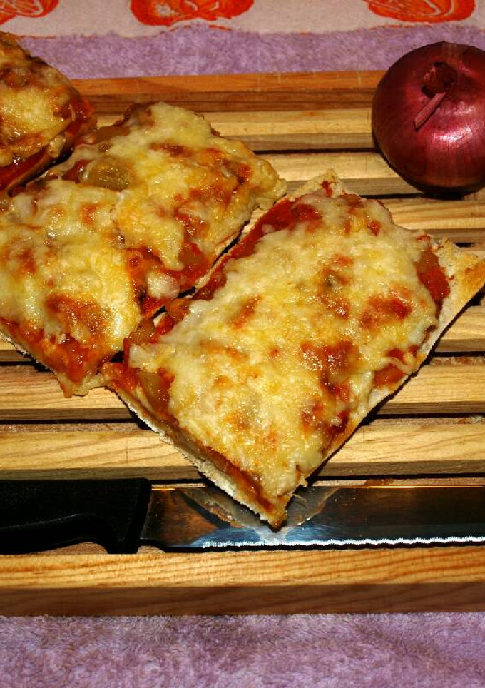 Una foto de Pan pizza de beicon 🍴