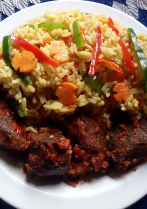 A picture of Vegetable and tomatoes stir fried rice.