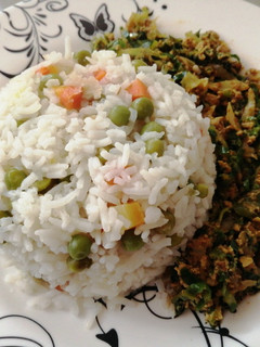 A picture of Vegetable rice with egg fried cabbage.