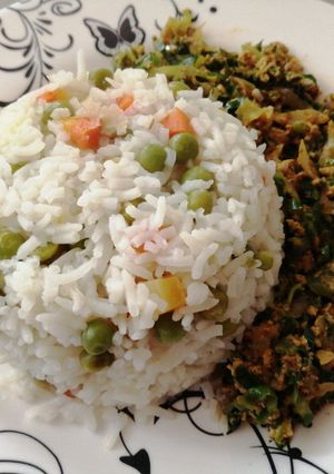 A picture of Vegetable rice with egg fried cabbage.