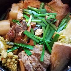 A picture of Pork neckbone cauliflower tofu stew.