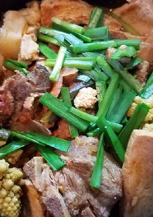 A picture of Pork neckbone cauliflower tofu stew.