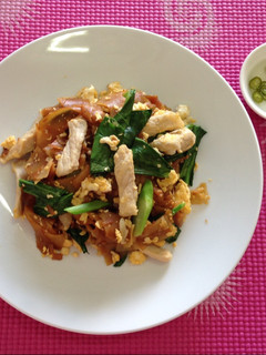 A picture of Stir fried noodles with black soy sauce and pork.