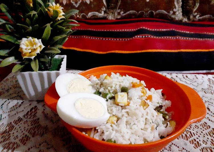 Veg paneer fried rice with boiled egg.