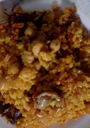 Una foto de Paella de conejo