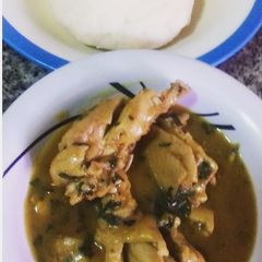 A picture of Ofe nsala with chicken and pounded yam.