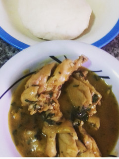 A picture of Ofe nsala with chicken and pounded yam.