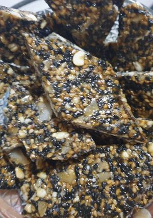 A picture of Mixed seed and coconut chikki.