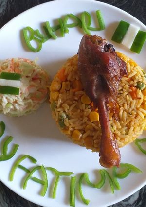 A picture of Jollof Rice with vegetables.