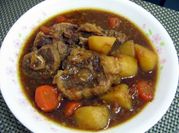 A picture of oxtails and potatoes