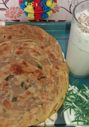 A picture of Lachha paratha with mint buttermilk.