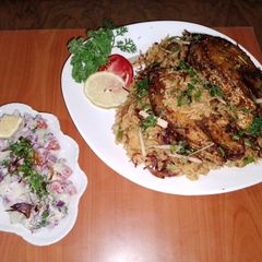 A picture of Fish vegetable biryani 🐟🥕🧅🍅🍋🧄and yoghurt kachumbari 🥗.