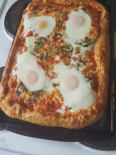 A picture of Pizza with egg.