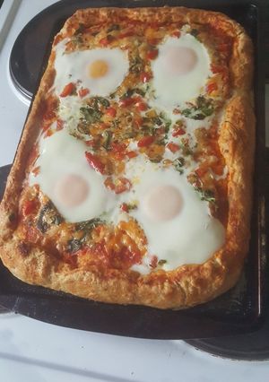 A picture of Pizza with egg.