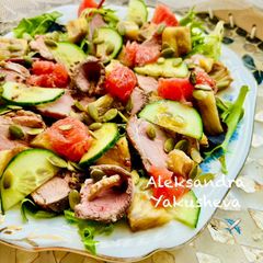 A picture of Duck breast baked with pineapples in grapefruit salad.