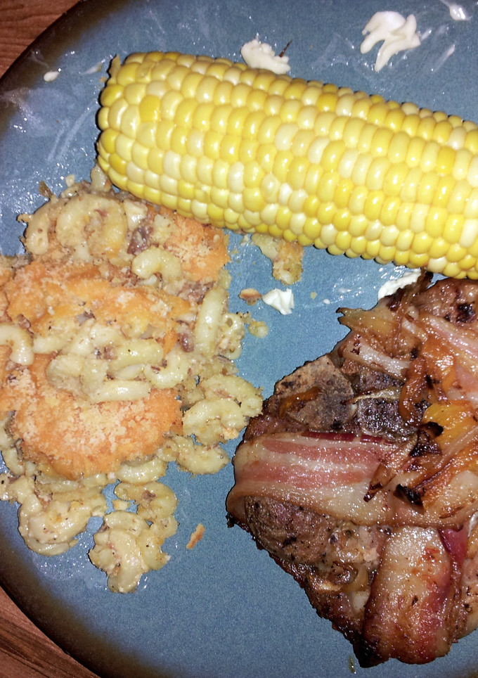A picture of Saucy Bacon wrapped Pork Chops.