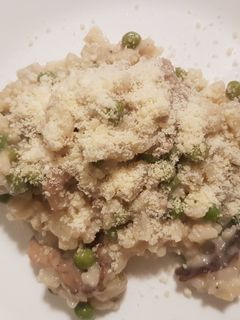 Une photo de Risotto champignons petits pois