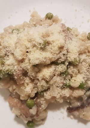 Une photo de Risotto champignons petits pois