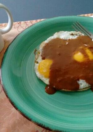A picture of Huevos Rancheros with Almond Mole.