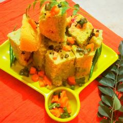 A picture of Multicolour veggie dhokla.