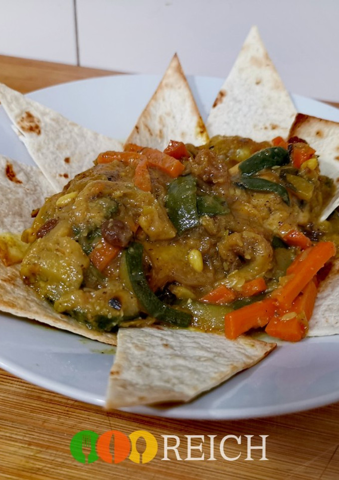 Una foto de Tajín de pollo y verduras con miel