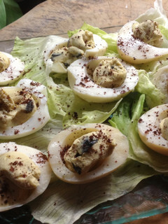 A picture of Devilled eggs with a sprinkling of sumac.