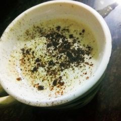 A picture of Instant hot coffee with chocolate powder.