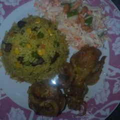 A picture of Fried rice,peppered chicken and coleslow.