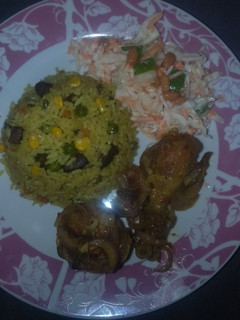 A picture of Fried rice,peppered chicken and coleslow.