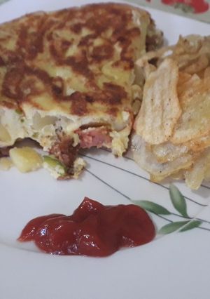 Una foto de Tortilla española a mi estilo 🤣
