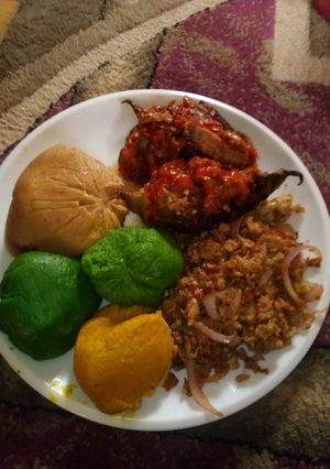 A picture of Coloured moi moi with pepper fish and scramble eggs.