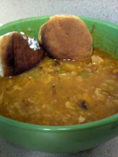 A picture of homemade chicken soup ( rican style ).