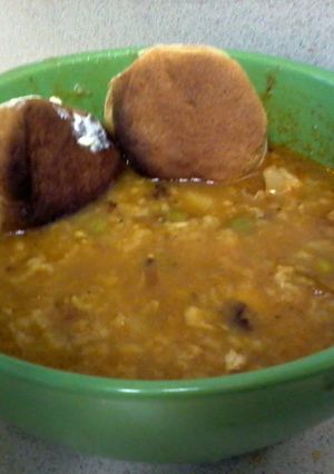 A picture of homemade chicken soup ( rican style ).