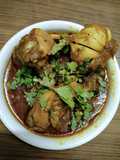 Chicken curry with whole garlic