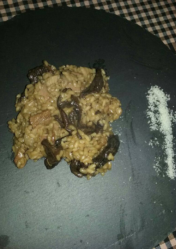 Una foto de Risotto de setas, panceta y parmesano