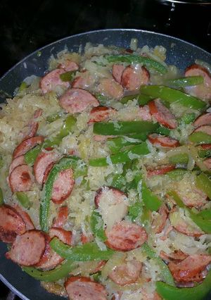 A picture of Bratwurst with Bell Peppers and Sauerkraut.