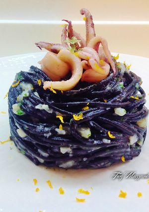 A picture of Squid Ink Spaghetti with Calamari and Cauliflower.